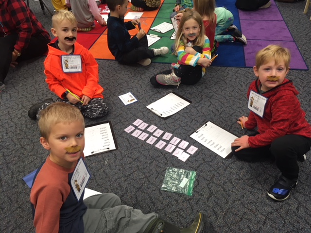 students on floor learning